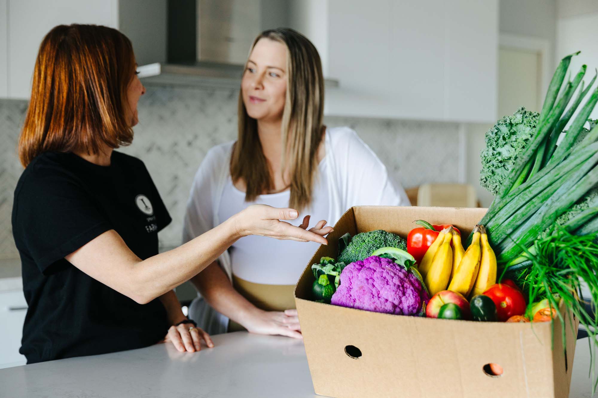 Women standing in kitchen