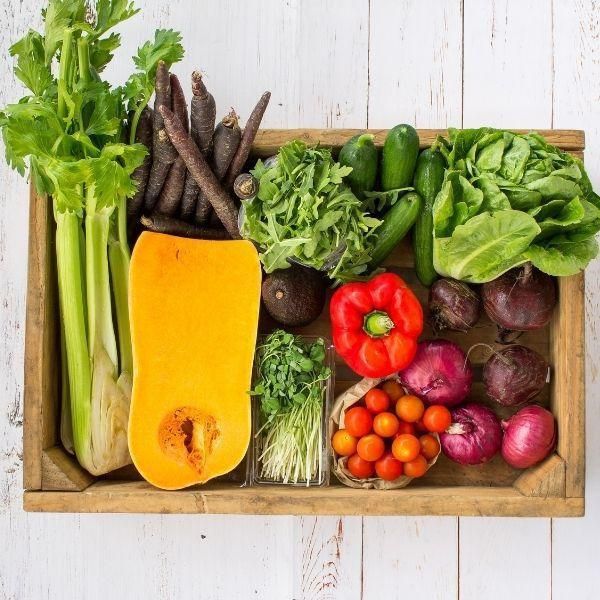 a box of fresh organic produce for making delicious salads