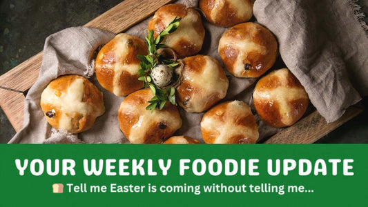 Hot cross buns on a baking tray