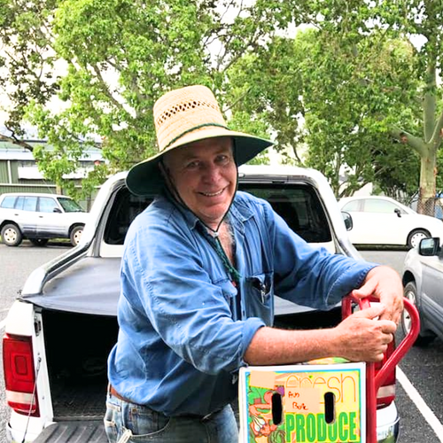 Local organic farmer with box of produce grown without chemicals in Mount Cotton