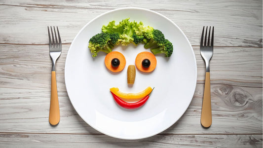 plate of vegetables making a smiling face