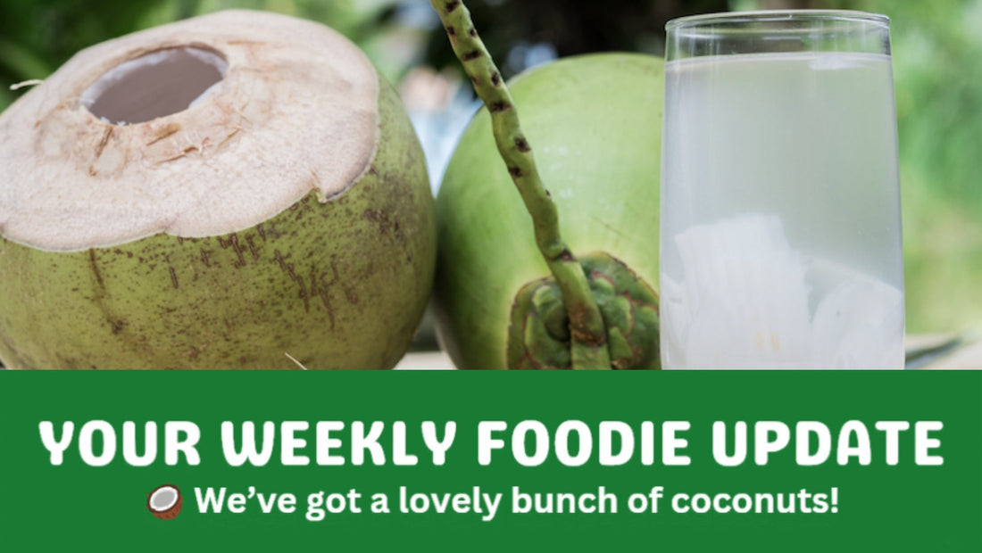 Coconuts and a glass full of coconut juice