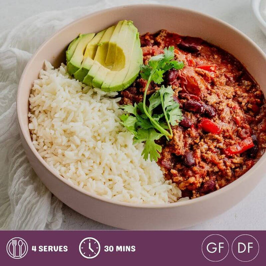 Vegetable chilli with rice and avocado in a bowl, accompanying a blog article about gluten-free and dairy-free cooking.