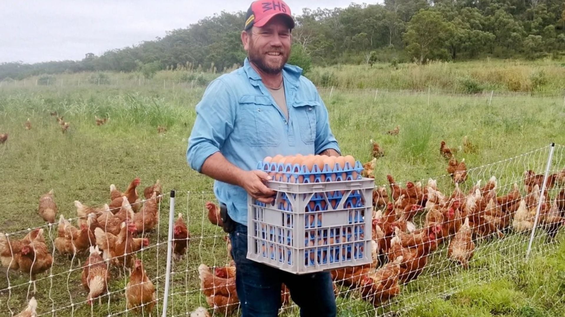 Randall Breen Farmer holding crate of pastured eggs from Echo Valley Farm